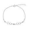 Zilveren armband met bolletjes, infinity teken en kristallen