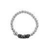 Zilveren ring, stretch, bolletjes en Bali element