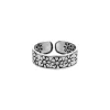 Zilveren teenring, brede band met bloemen